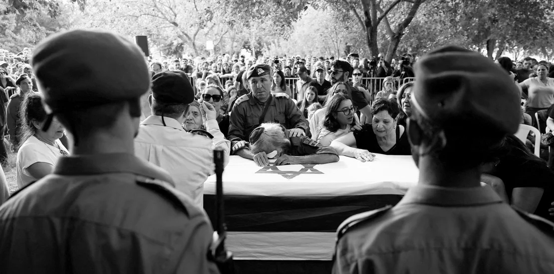 People mourn Israeli soldier Sgt. Amitai Alon, who was killed in the drone attack on Sunday. Gonzalo Fuentes/Reuters